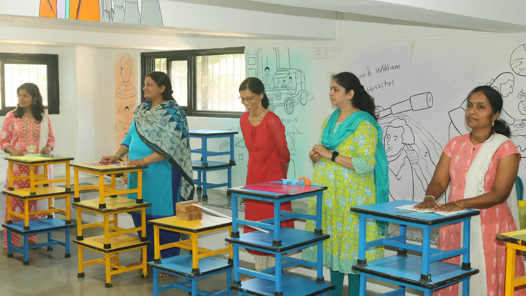 Teachers gethered around lab tables